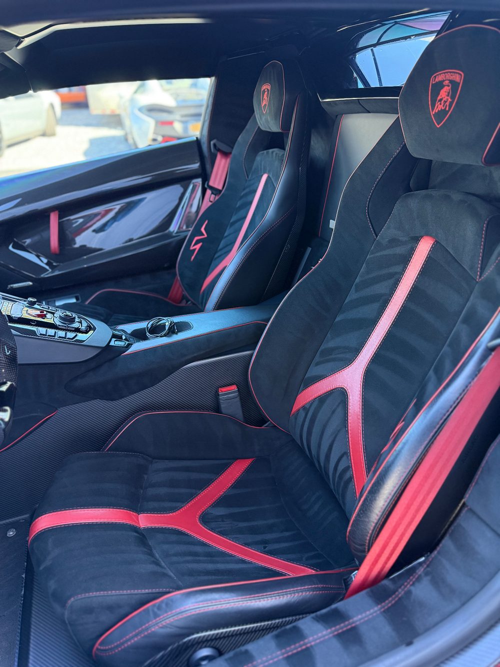 Detailed Lamborghini interior, leather and alcantara seats cleaned by Chrissy's Mobile Detailing