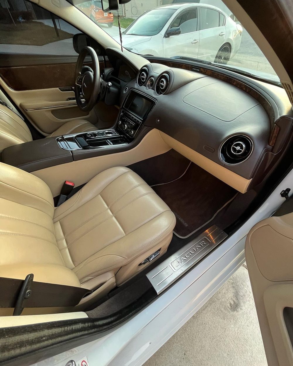 Detailed tan leather Jaguar interior by Chrissy's Mobile Detailing